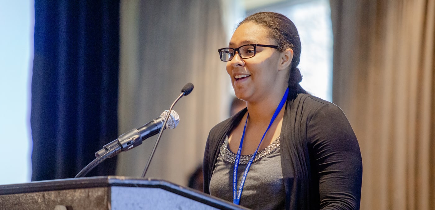 Cheyenne Lei pitching her poster at GLBRC's annual poster pitch slam