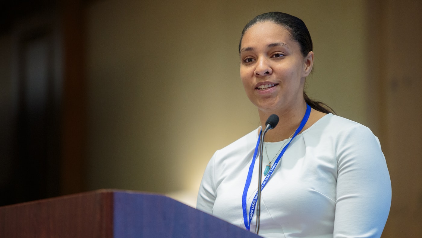 Cheyenne Lei speaking at a podium