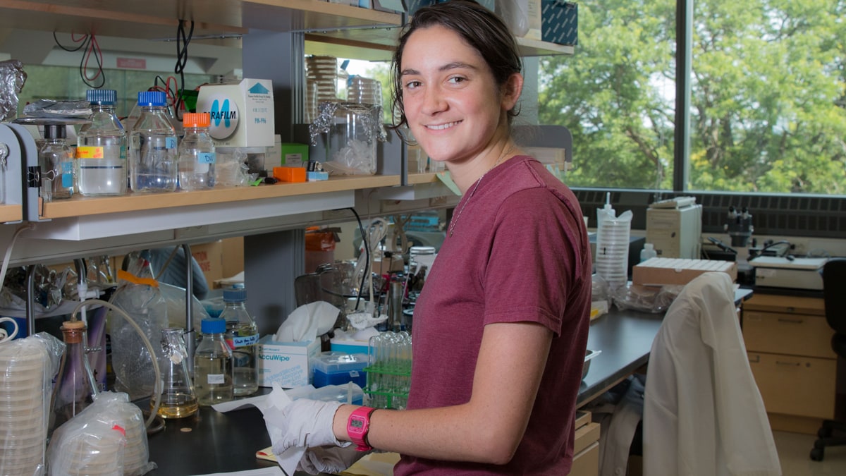 Julia Martien stands in front of a lab bench