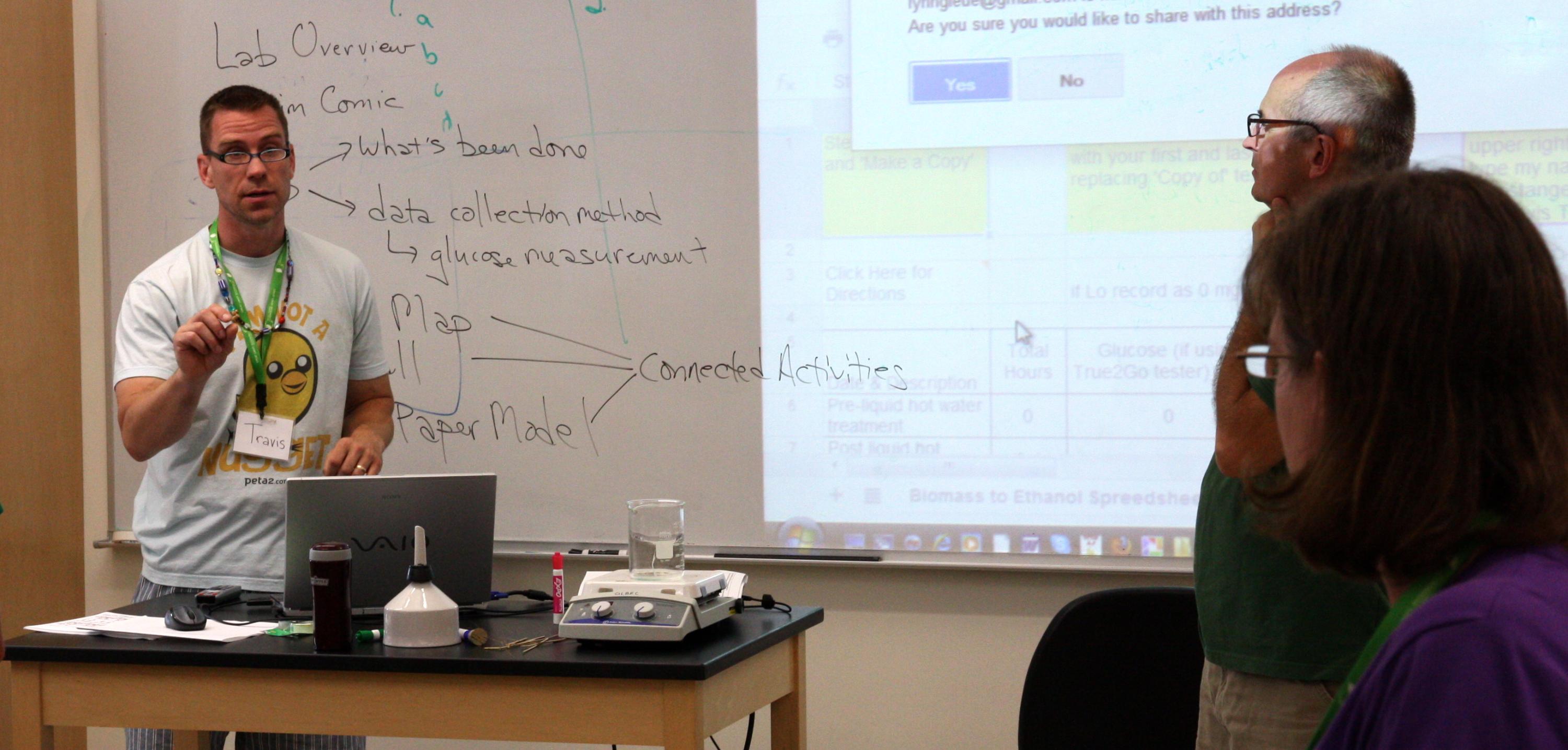 RET participant Travis Tangen describes his lab protocol to teachers at the 2012 Bioenergy Institute for Educators.