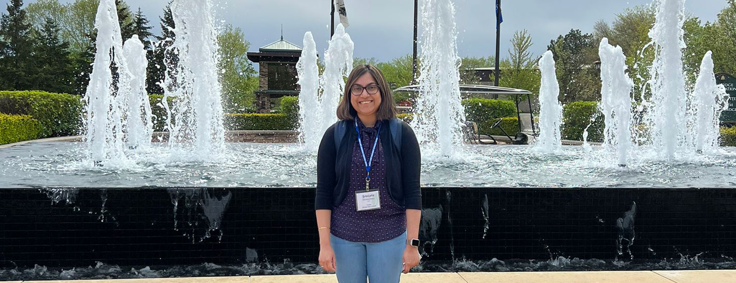 Sreejata Bandopadhyay stands in front of a fountain