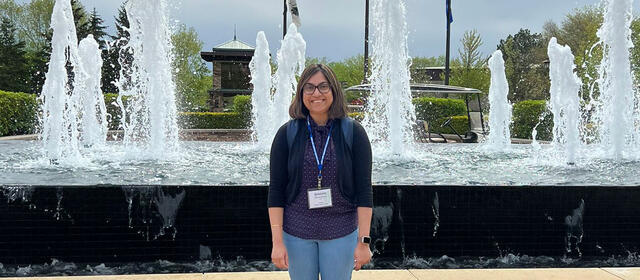 Sreejata Bandopadhyay stands in front of a fountain