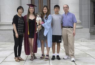 family posing in front of capitol building