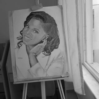 Hyper-realistic drawing of a dark-haired woman on an easel