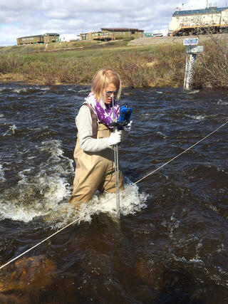 Adrianna Trusiak standing in a stream