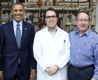 President Obama, Leonardo da Costa Sousa (middle), and Bruce Dale (right) after the President's tour of Dale's lab at Michigan State University in 2014.