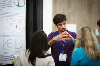 Scientist describes research to onlookers