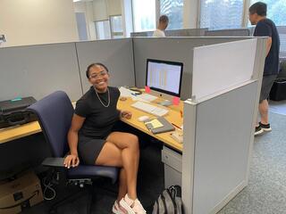 Jules Seay sitting at a desk. 