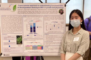 Sherry Sun stands to the right of her research poster