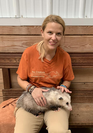 Adrianna Trusiak holding Athena the opossum