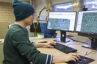 Postdoctoral researcher Yanhua Xie works at a computer at the Wisconsin Energy Institute in Madison, Wis.