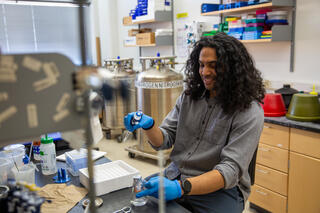 Daven at lab bench working with glassware