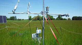 An instrument tower in a field