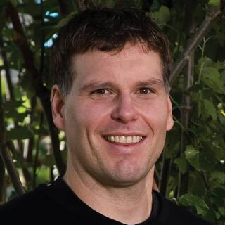 A headshot of Shawn Mansfield